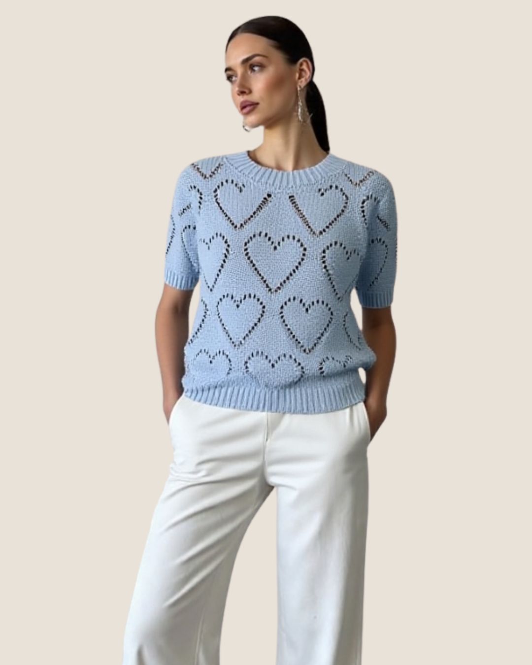 Blusa tejida de corazones celeste