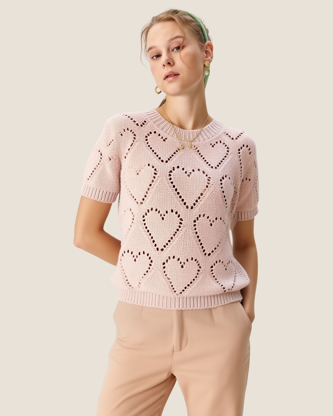 Blusa tejida de corazones palo rosa