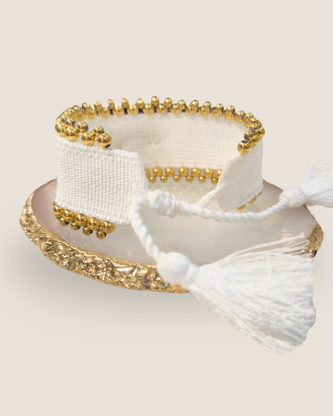 Pulsera tejida con dije de ojo