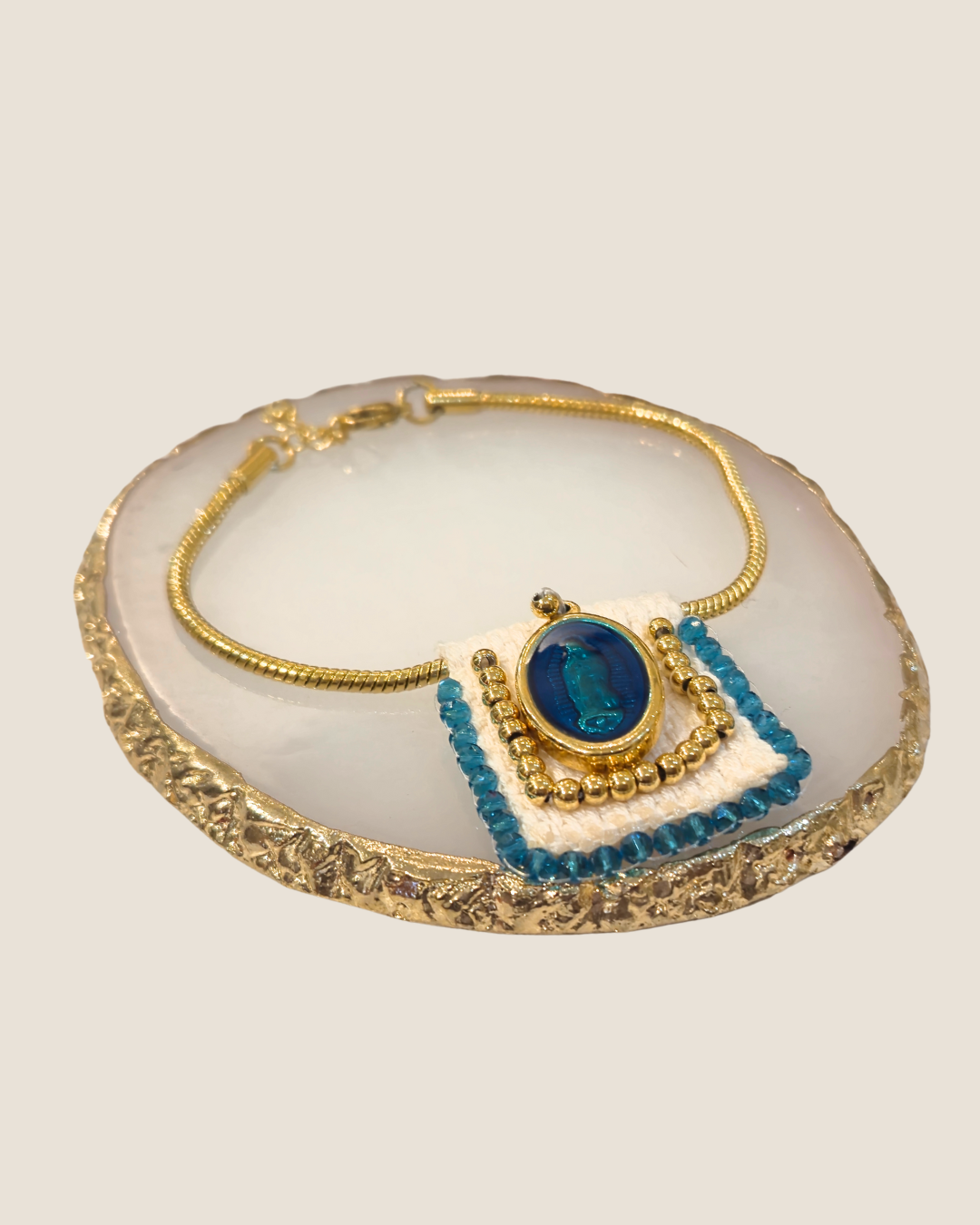 Pulsera celeste con diseño de virgen Maria